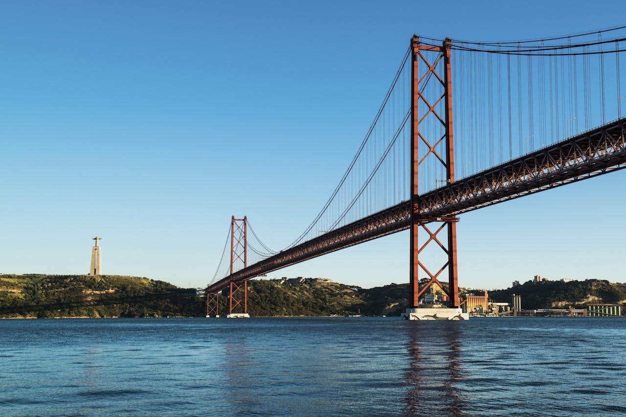 why-choose-us Explore the stunning architecture of the 25 de Abril Bridge spanning the Tagus River in Lisbon, Portugal.